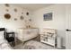 Charming Bedroom with crib, changing table, and decor at 9919 N 47Th Pl, Phoenix, AZ 85028