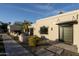 Contemporary home with modern entryway and nicely landscaped walkway at 9919 N 47Th Pl, Phoenix, AZ 85028