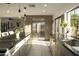Bright kitchen boasts stainless steel refrigerator and ample counter space at 9919 N 47Th Pl, Phoenix, AZ 85028