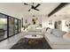 Open concept living room with comfortable seating and large windows at 9919 N 47Th Pl, Phoenix, AZ 85028