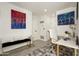 Bright home office features a workspace and comfortable seating at 9919 N 47Th Pl, Phoenix, AZ 85028
