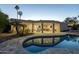 Inviting kidney-shaped pool with surrounding patio and landscape at 9919 N 47Th Pl, Phoenix, AZ 85028