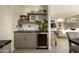 Modern wet bar with wine cooler and sleek cabinetry at 9919 N 47Th Pl, Phoenix, AZ 85028