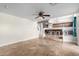 Open living area with tile flooring and view of the kitchen at 12406 W Berry Ln, El Mirage, AZ 85335