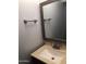 Half bathroom with a sink, mirror, and towel rack at 12445 N 21St Ave # 31, Phoenix, AZ 85029