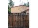 Exterior view of the property from behind a wooden fence at 12445 N 21St Ave # 31, Phoenix, AZ 85029