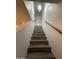 Staircase with wood-look tile flooring leading to the upper level at 12445 N 21St Ave # 31, Phoenix, AZ 85029
