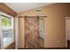 Bathroom with barn door and updated fixtures at 14267 S 43Rd Pl, Phoenix, AZ 85044