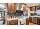 Kitchen with stainless steel range hood and granite countertops at 1816 E Enrose St, Mesa, AZ 85203