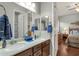 Double vanity bathroom with granite counters and large mirrors at 1835 W Kingbird Dr, Chandler, AZ 85286