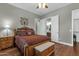 Bedroom with wooden furniture and ensuite bathroom at 1835 W Kingbird Dr, Chandler, AZ 85286