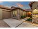 Inviting entryway with a stone walkway leading to a wood front door at 1835 W Kingbird Dr, Chandler, AZ 85286