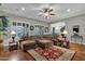 Spacious living room featuring a large sectional sofa and hardwood floors at 1835 W Kingbird Dr, Chandler, AZ 85286