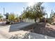 A single-story home with a two-car garage, desert landscaping, and a tree in the front yard at 18589 W Fulton St, Goodyear, AZ 85338