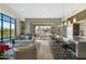 Bright community room with comfortable seating and access to outdoor kitchen and pool at 2 E Biltmore Estates Dr # 115, Phoenix, AZ 85016