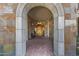Elegant entryway with arched doorway and stone details at 2 E Biltmore Estates Dr # 115, Phoenix, AZ 85016