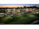 Luxury community at sunset, featuring attractive architecture and lush landscaping at 2 E Biltmore Estates Dr # 115, Phoenix, AZ 85016