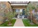 Private courtyard with artificial turf and seating area at 2 E Biltmore Estates Dr # 115, Phoenix, AZ 85016