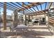 Relaxing pergola with outdoor seating and grill at 2 E Biltmore Estates Dr # 115, Phoenix, AZ 85016