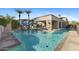Inviting community pool with lounge chairs and palm trees at 2 E Biltmore Estates Dr # 115, Phoenix, AZ 85016