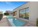 Resort-style pool with expansive patio and building views at 2 E Biltmore Estates Dr # 115, Phoenix, AZ 85016