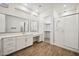 Modern bathroom with double vanity, walk-in shower, and large mirrors at 21504 E Pecan Ct, Queen Creek, AZ 85142