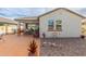 Back patio with seating area, built-in grill, and decorative wall at 2864 W Canada De Oro Rd, San Tan Valley, AZ 85144