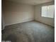 Empty bedroom with carpet flooring and window with blinds at 3418 S 177Th Dr, Goodyear, AZ 85338