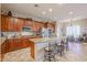 Spacious kitchen featuring granite countertops, stainless steel appliances, and breakfast bar at 3512 W Hidden Mountain Ct, Phoenix, AZ 85086