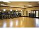 Spacious fitness center with exercise bikes, mirrors, and ample natural light at 36011 N Stoneware Dr, Queen Creek, AZ 85140