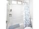 Clean bathroom with shower/tub combo and blue patterned shower curtain at 36023 N 140Th St, Scottsdale, AZ 85262