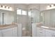 Modern bathroom featuring a glass shower, dual vanities, and contemporary fixtures at 36023 N 140Th St, Scottsdale, AZ 85262