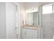 Guest bathroom with white cabinetry, modern fixtures, and a tiled shower at 36023 N 140Th St, Scottsdale, AZ 85262