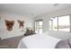 Cozy bedroom with sliding glass door leading to the backyard at 36023 N 140Th St, Scottsdale, AZ 85262