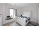Bedroom with a white bedframe and wood-look tile floors at 36023 N 140Th St, Scottsdale, AZ 85262
