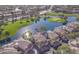 Stunning aerial view of a golf course community with a lake at 3800 S Cantabria Cir # 1023, Chandler, AZ 85248