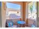 Small balcony with seating area, overlooking the complex and tile roofs at 3800 S Cantabria Cir # 1023, Chandler, AZ 85248