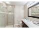 Bathroom with tiled shower, dark wood vanity, and modern fixtures at 3800 S Cantabria Cir # 1023, Chandler, AZ 85248