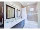 Modern bathroom with double vanity, tiled shower, and updated fixtures at 3800 S Cantabria Cir # 1023, Chandler, AZ 85248