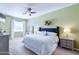Large bedroom with king-size bed, ceiling fan, and ample natural light at 3800 S Cantabria Cir # 1023, Chandler, AZ 85248