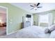 Bedroom with ceiling fan, comfy bed, and attached sitting area at 3800 S Cantabria Cir # 1023, Chandler, AZ 85248