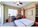 Bedroom with built-in Murphy bed, desk, and private balcony access at 3800 S Cantabria Cir # 1023, Chandler, AZ 85248