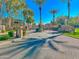 Gated entrance to the community with palm trees at 3800 S Cantabria Cir # 1023, Chandler, AZ 85248