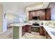 Modern kitchen with a breakfast bar, stainless steel appliances, and plenty of cabinet space at 3800 S Cantabria Cir # 1023, Chandler, AZ 85248
