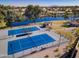 Community tennis courts next to a lake and recreation area at 3800 S Cantabria Cir # 1023, Chandler, AZ 85248
