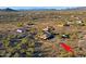 Aerial perspective of a desert community with homes scattered amidst natural vegetation at 42609 N 19Th St, New River, AZ 85087