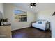 Bedroom with daybed, wood floors, and window with mountain views at 42609 N 19Th St, New River, AZ 85087