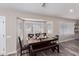 Cozy dining area with a bay window, wood-look floors, and a dark wood table with seating at 4326 E Stanford Ave, Gilbert, AZ 85234