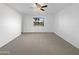 Empty bedroom with carpeting and a ceiling fan at 44792 W Miraflores St, Maricopa, AZ 85139