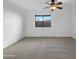Spacious bedroom with carpeting and a ceiling fan at 44792 W Miraflores St, Maricopa, AZ 85139